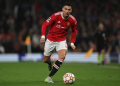 Manchester United's Portuguese striker Cristiano Ronaldo runs with the ball during the UEFA Champions League round of 16 second leg football match between Manchester United and Atletico Madrid at Old Trafford stadium in Manchester, north west England on March 15, 2022. (Photo by Paul ELLIS / AFP) (AFP/PAUL ELLIS)